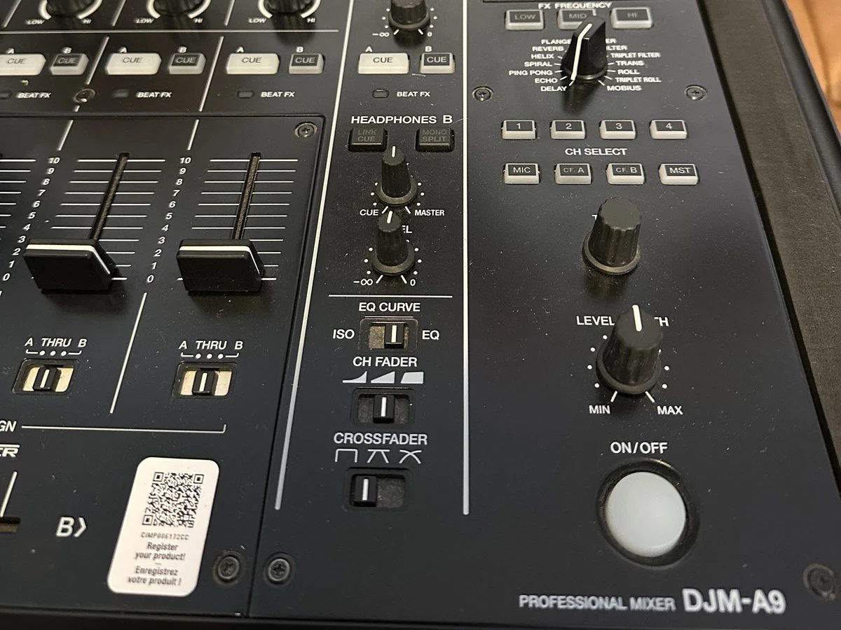 The effects section and master controls of a Pioneer DJ DJM-A9 mixer in its road case