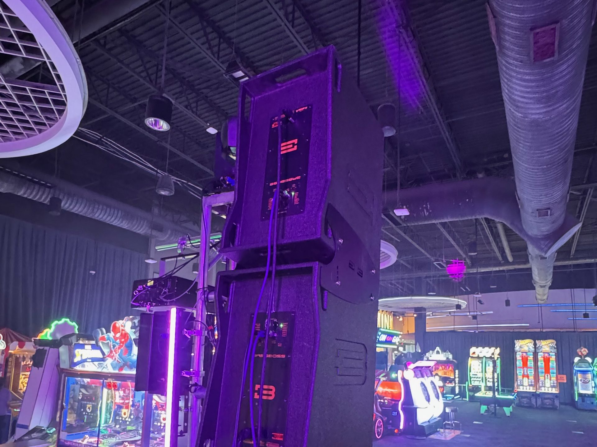 The rear of a BassBoss DV12 array raised on a stand at a Dallas venue